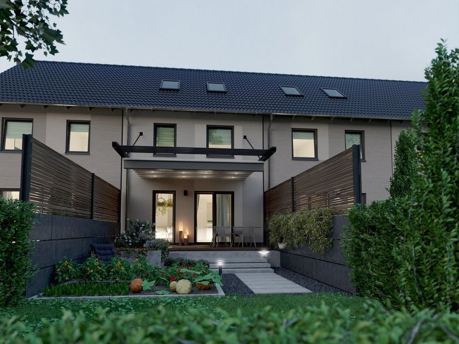 Modernes Reihenhaus Mainz 128 als Massivbau mit vier Wohneinheiten Massiv gebautes Reihenhaus Mainz 128 mit vier Wohneinheiten Gartenansicht in Abendstimmung